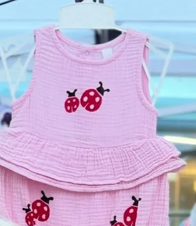 Pink cotton gauze ruffle top and bloomers stamped with ladybugs